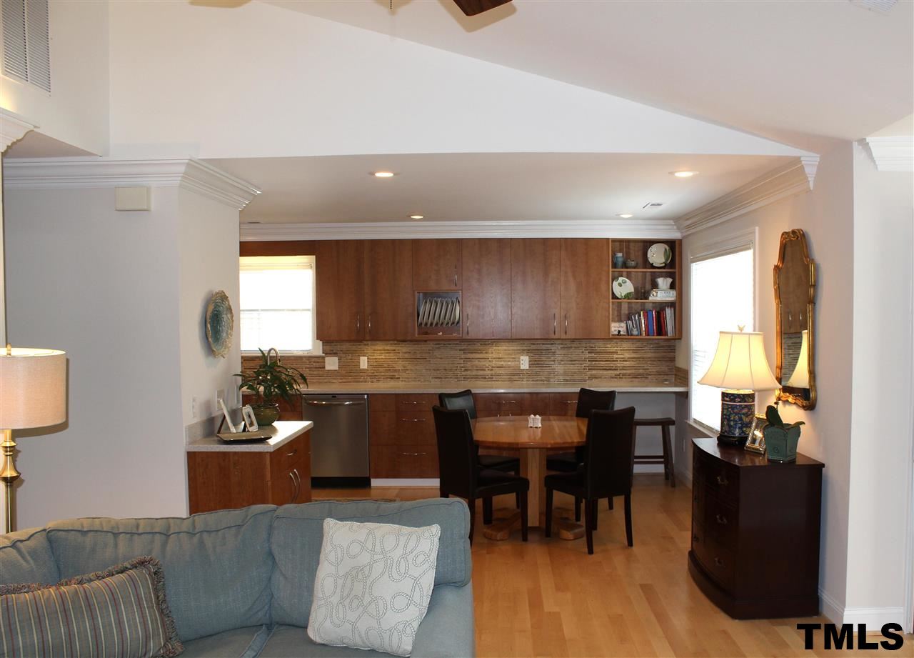 1045 Mills Street Raleigh, NC 27608 - Photo 5 of 20 a kitchen with a table and chairs in it