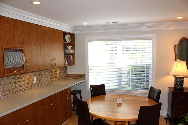1045 Mills Street Raleigh, NC 27608 - Photo 8 of 20 a view of a dining room with furniture window and outside view