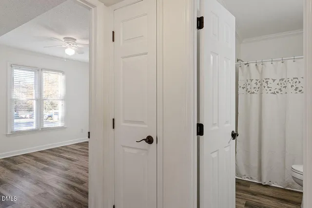 a view of a bathroom with wooden floor