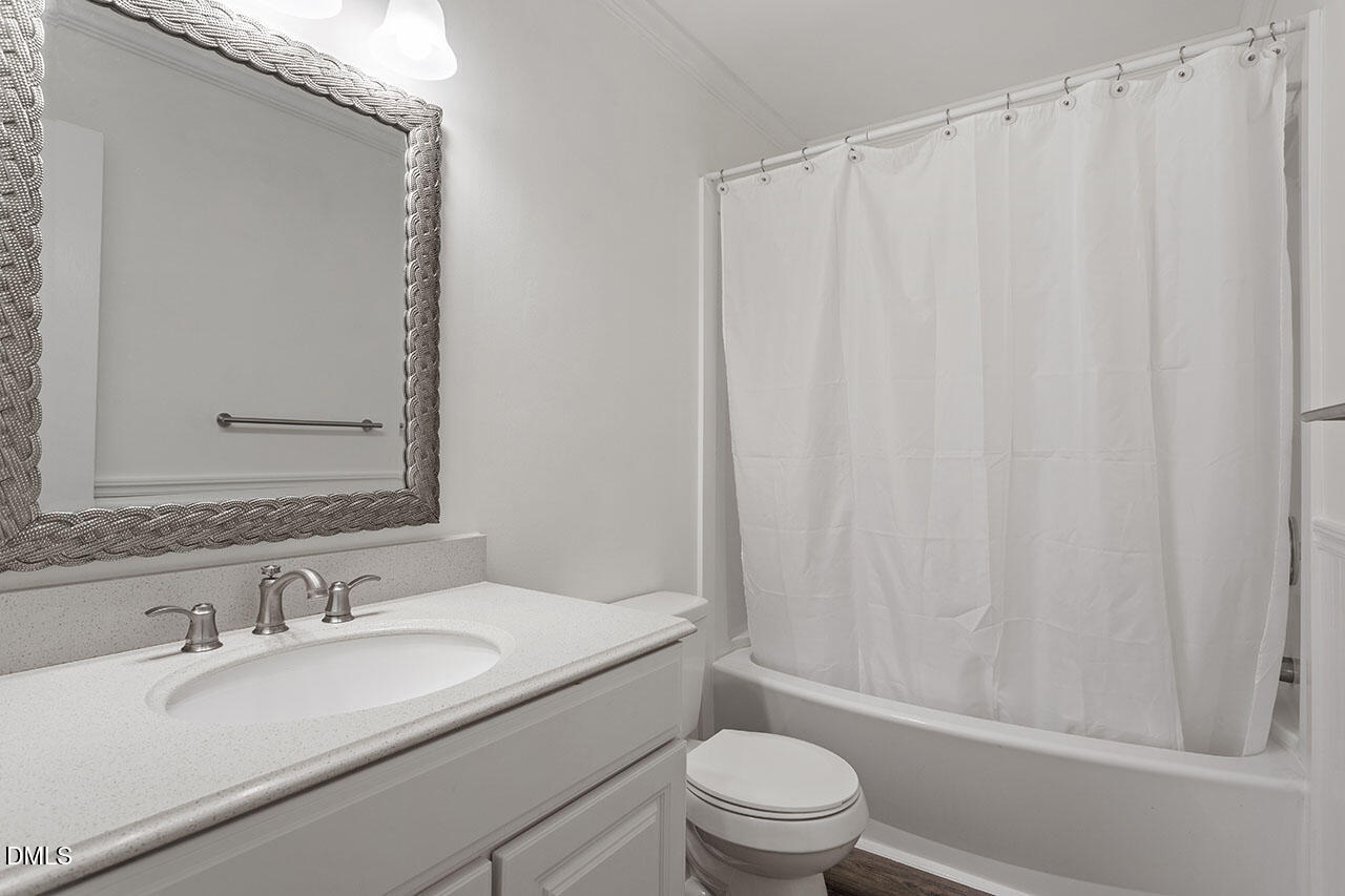 2306 Stafford Avenue, Unit D Raleigh, NC 27607 - Photo 24 of 24 a bathroom with a granite countertop sink toilet and shower