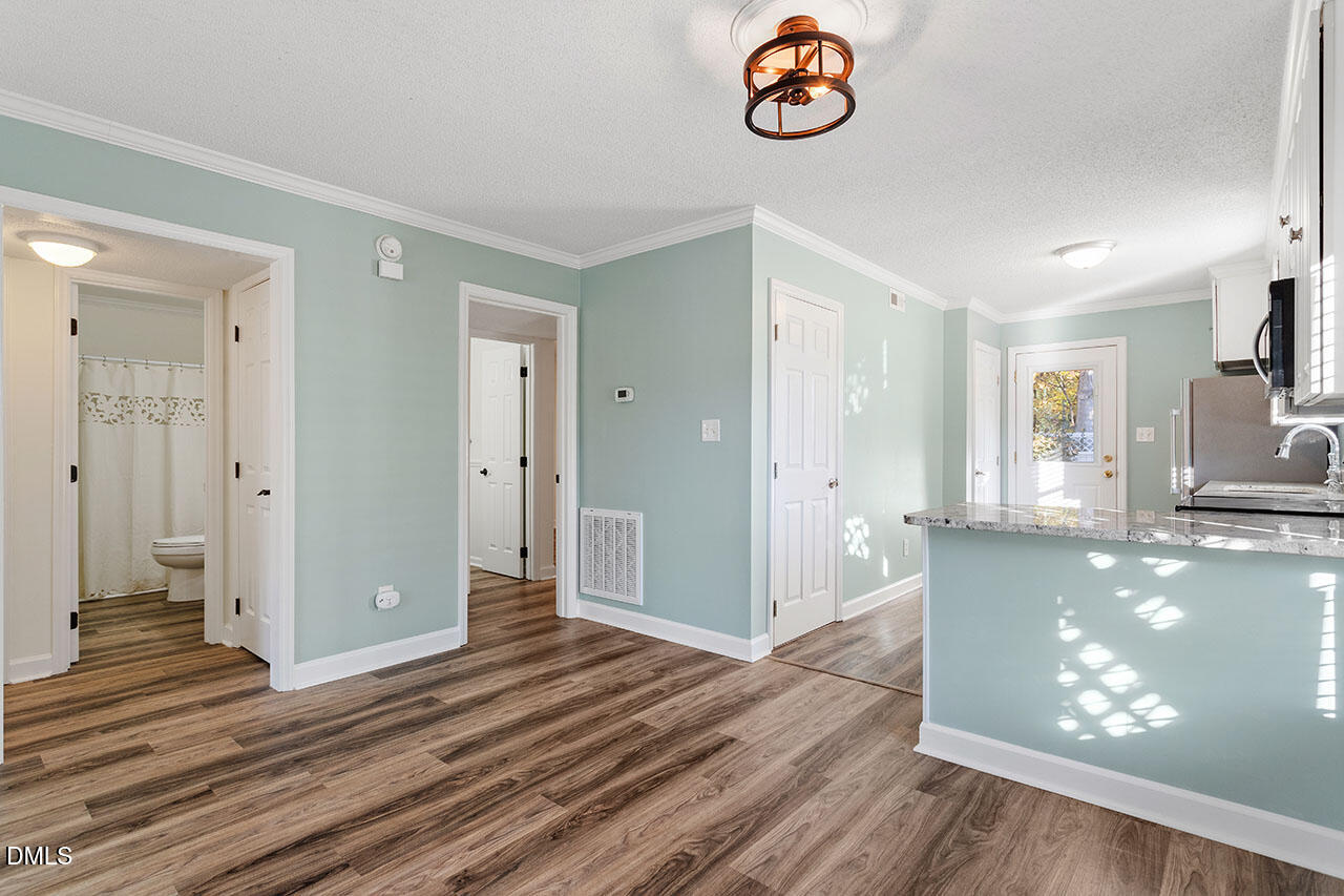 2306 Stafford Avenue, Unit D Raleigh, NC 27607 - Photo 10 of 24 a view of a kitchen with wooden floor and a window