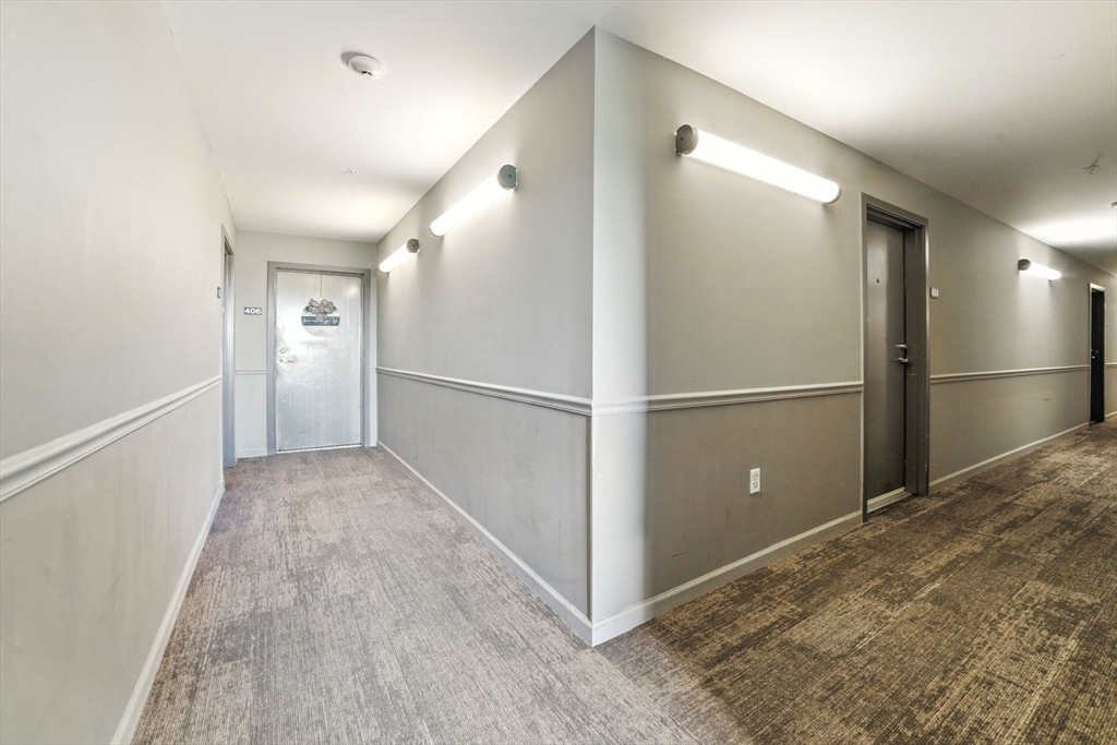 210 Broadway, Unit 406 Everett, MA 02149 - Photo 23 of 33 a view of entryway with wooden floor