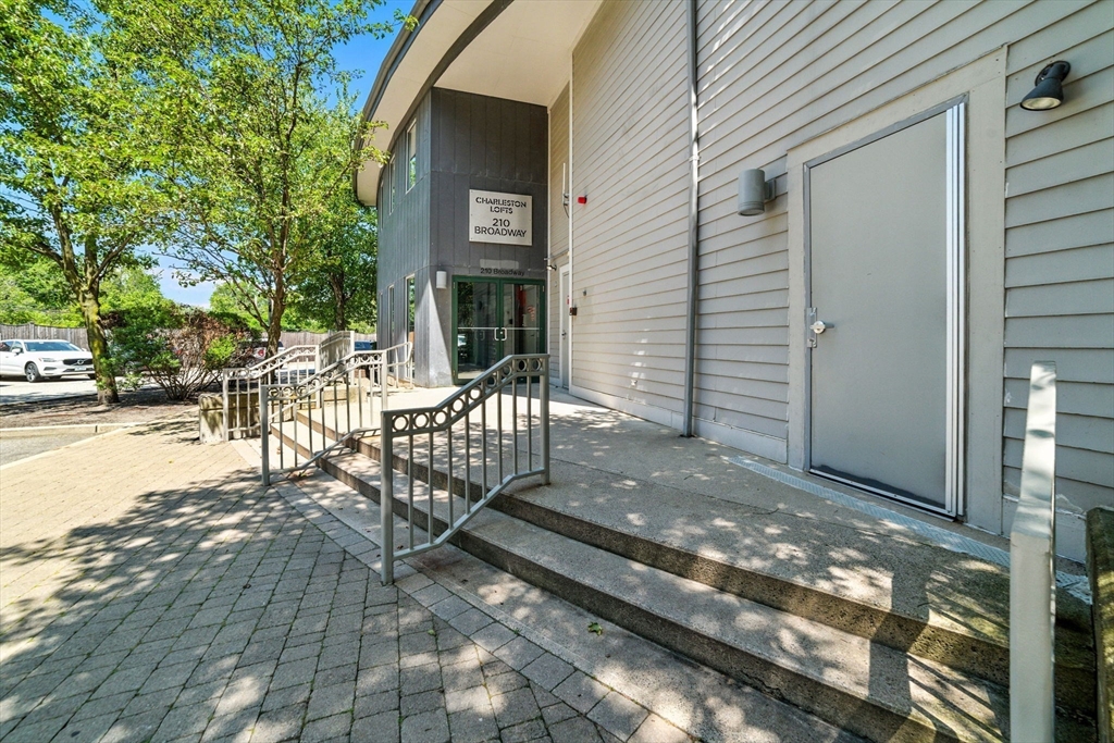 210 Broadway, Unit 406 Everett, MA 02149 - Photo 26 of 33 a view of a outdoor space with porch