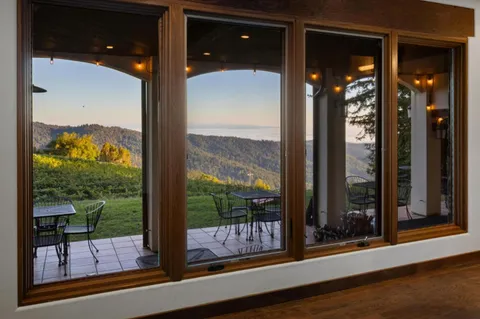 a view of a glass door of the house
