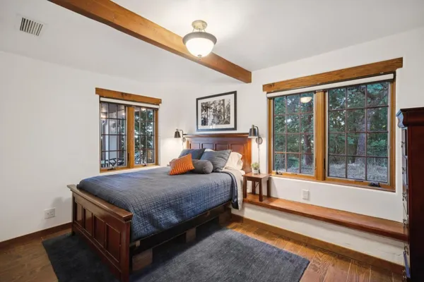 a bed sitting in front of a window