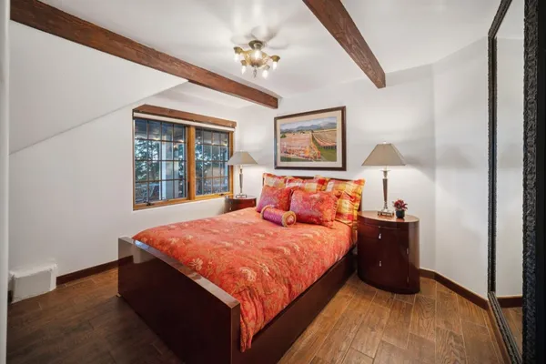 a bedroom with bed and window