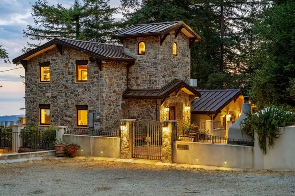 a front view of a house with a yard