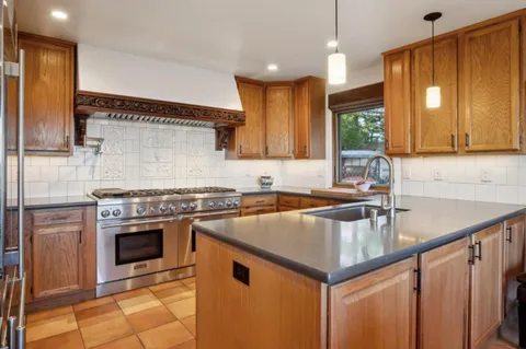 a kitchen with a stove and a sink
