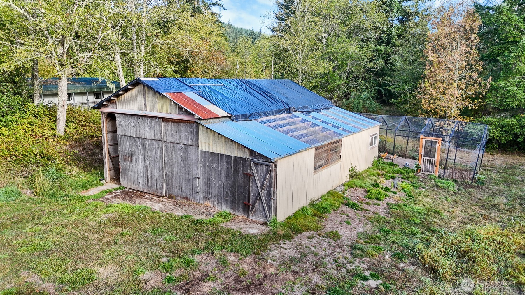 14440 Vantine Road Southeast Tenino, WA 98589 - Photo 3 of 18 a view of a small house with wooden fence