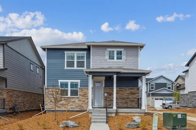 a front view of a house with parking