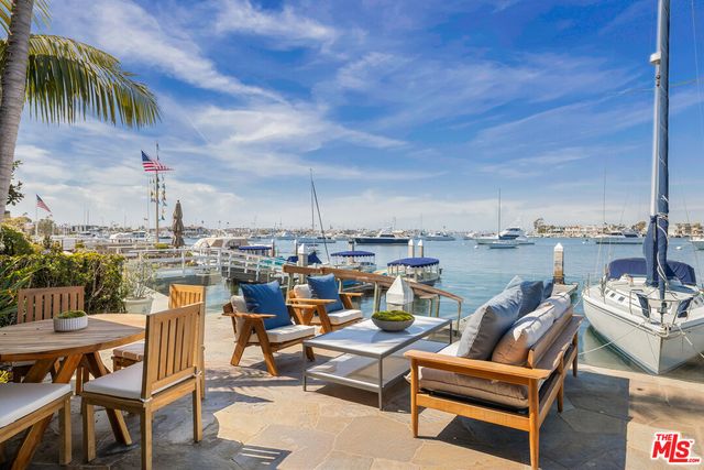 a view of swimming pool with seating area and furniture