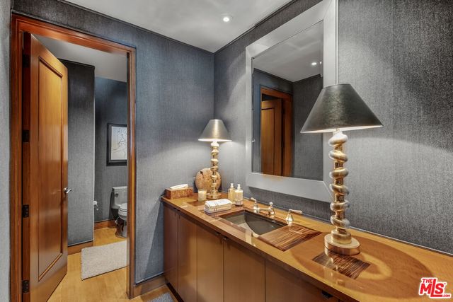 a room with a sink and a mirror