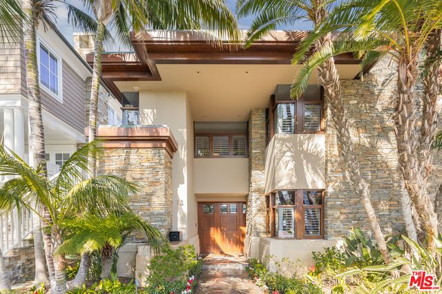 a view of a tall building with a tree