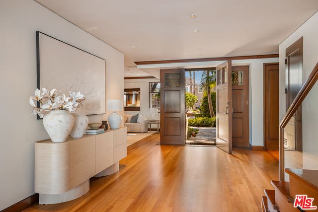 a view of a living room and entryway