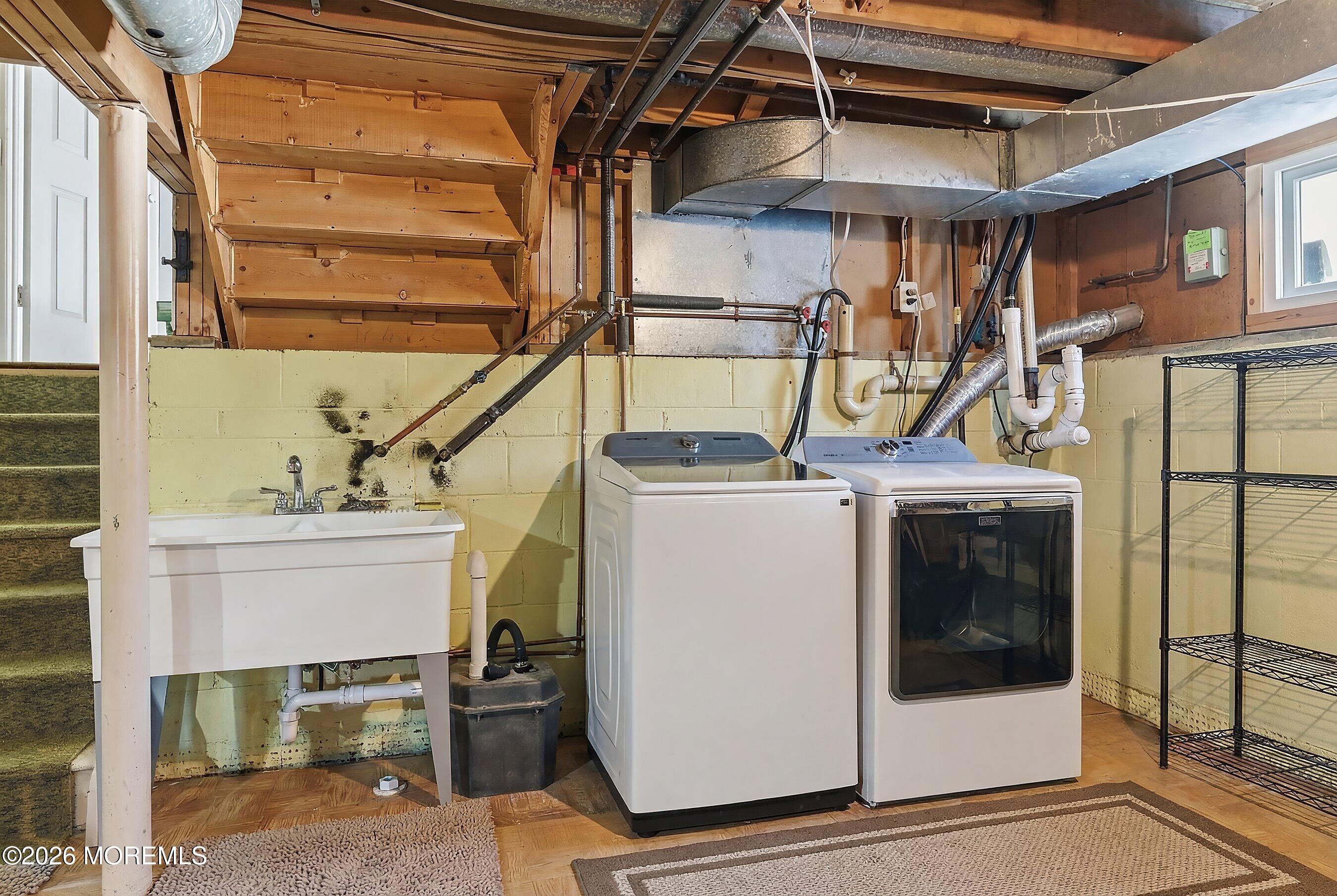7 Colonial Court Howell, NJ 07731 - Photo 11 of 36 a utility room with dryer and washer