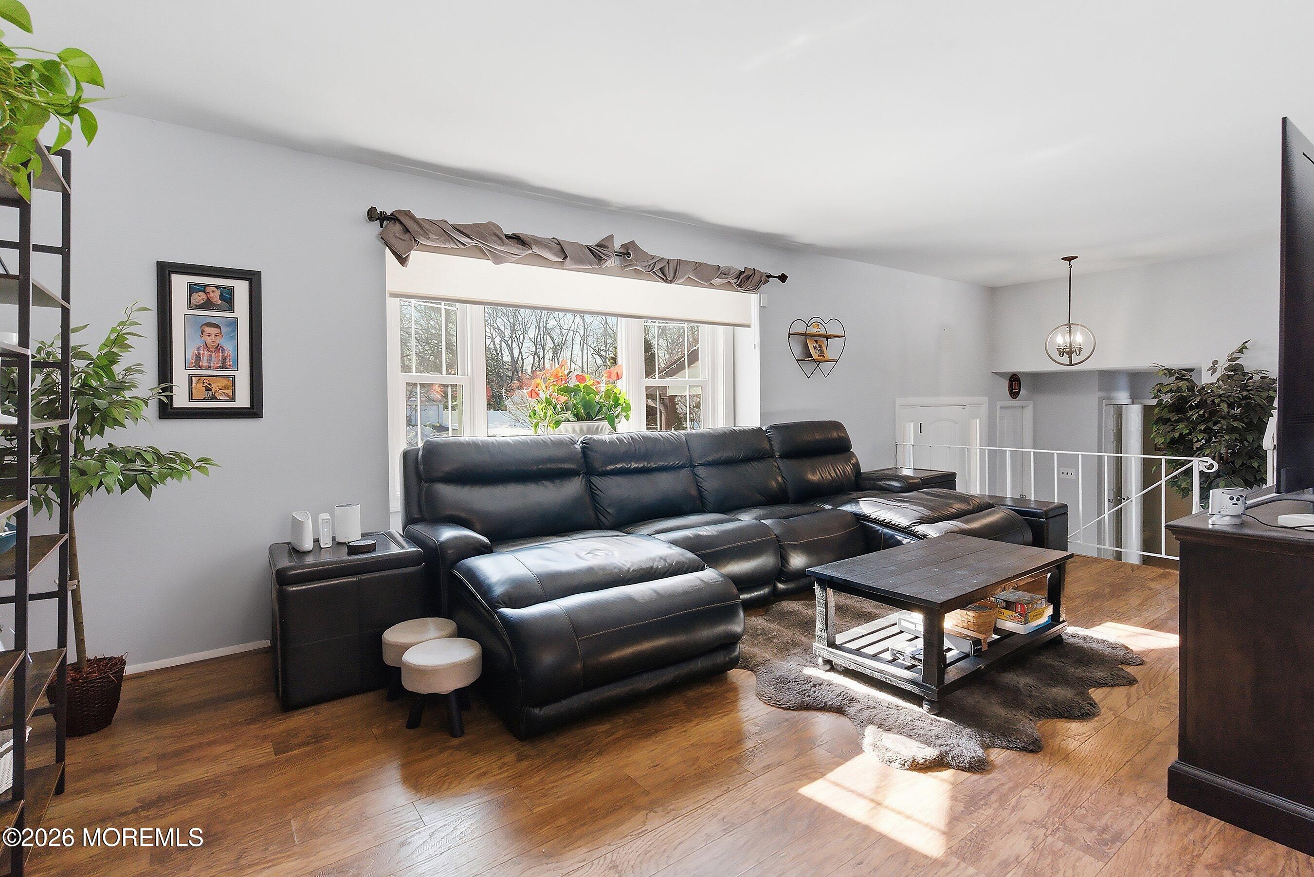 7 Colonial Court Howell, NJ 07731 - Photo 19 of 36 a living room with furniture and a large window