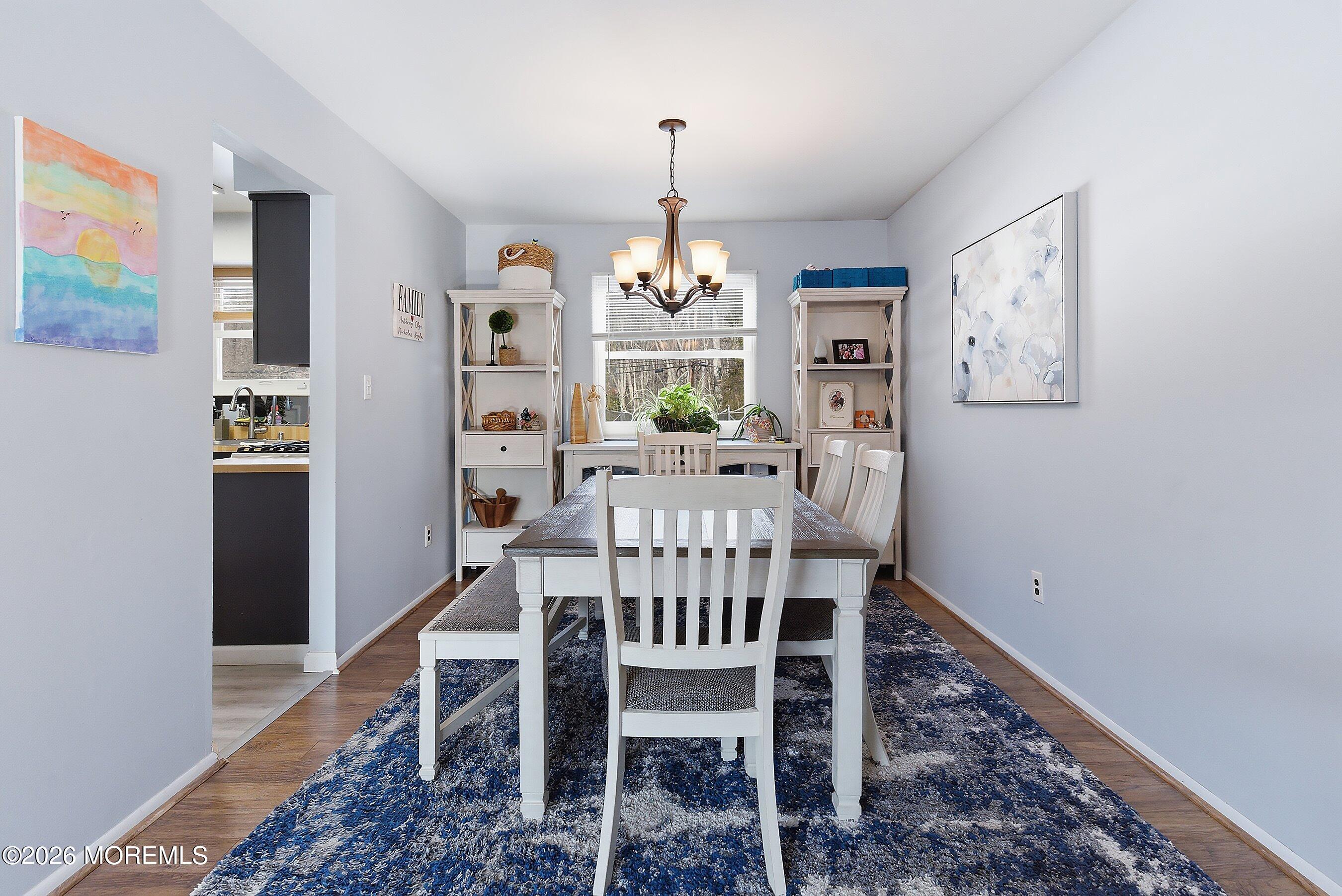 7 Colonial Court Howell, NJ 07731 - Photo 20 of 36 a view of a dining room with furniture window and wooden floor