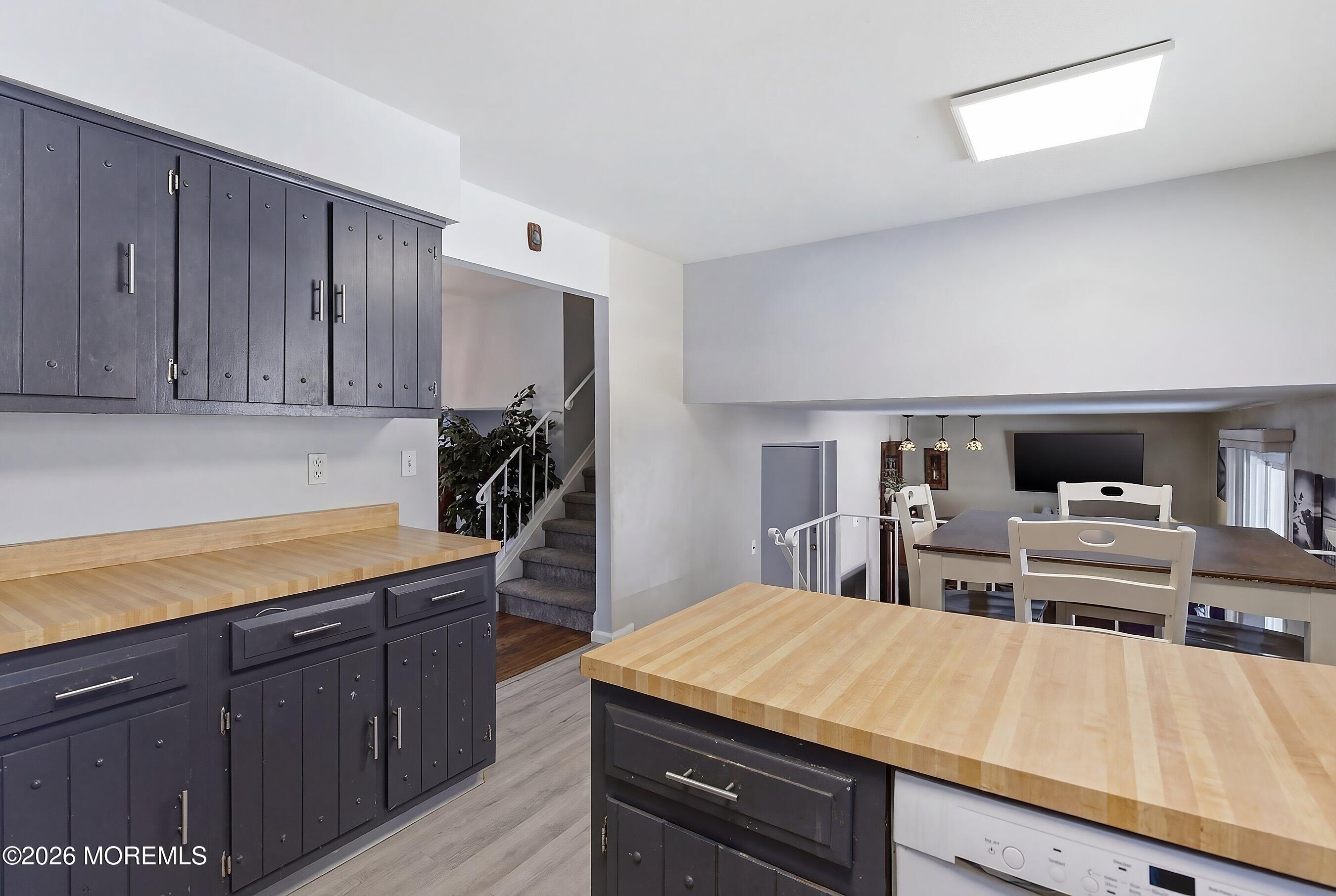 7 Colonial Court Howell, NJ 07731 - Photo 2 of 36 a kitchen with kitchen island sink refrigerator and stove