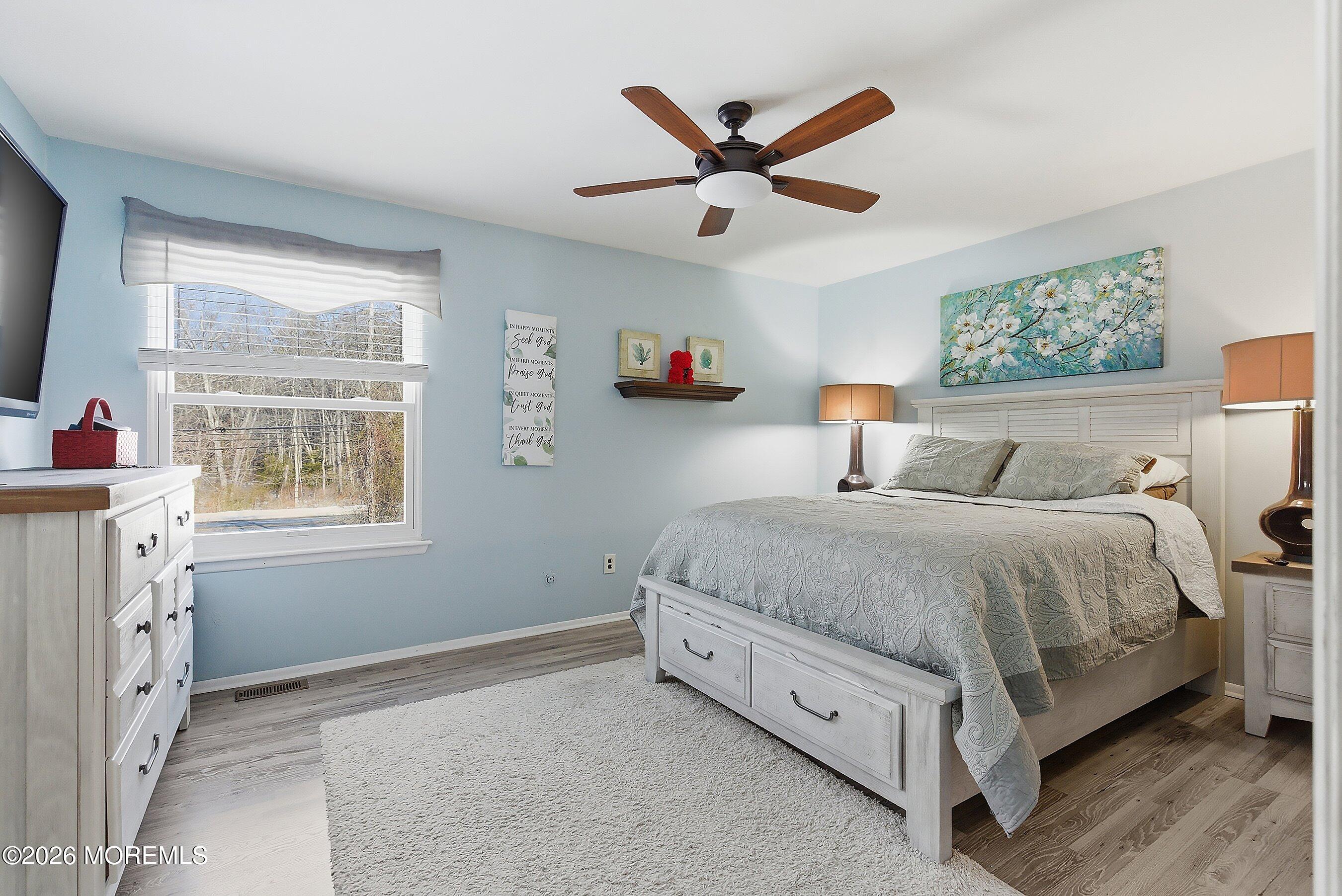 7 Colonial Court Howell, NJ 07731 - Photo 27 of 36 a spacious bedroom with a bed and a window