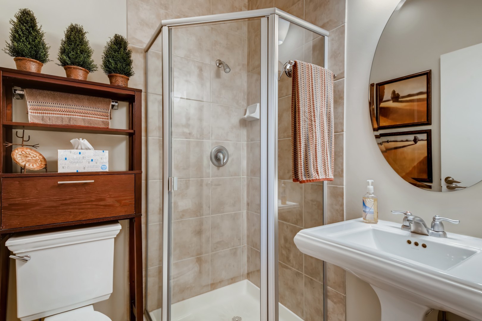 1244 West Monroe Street, Unit 5 Chicago, IL 60607 - Photo 11 of 21 a bathroom with a sink a mirror and shower