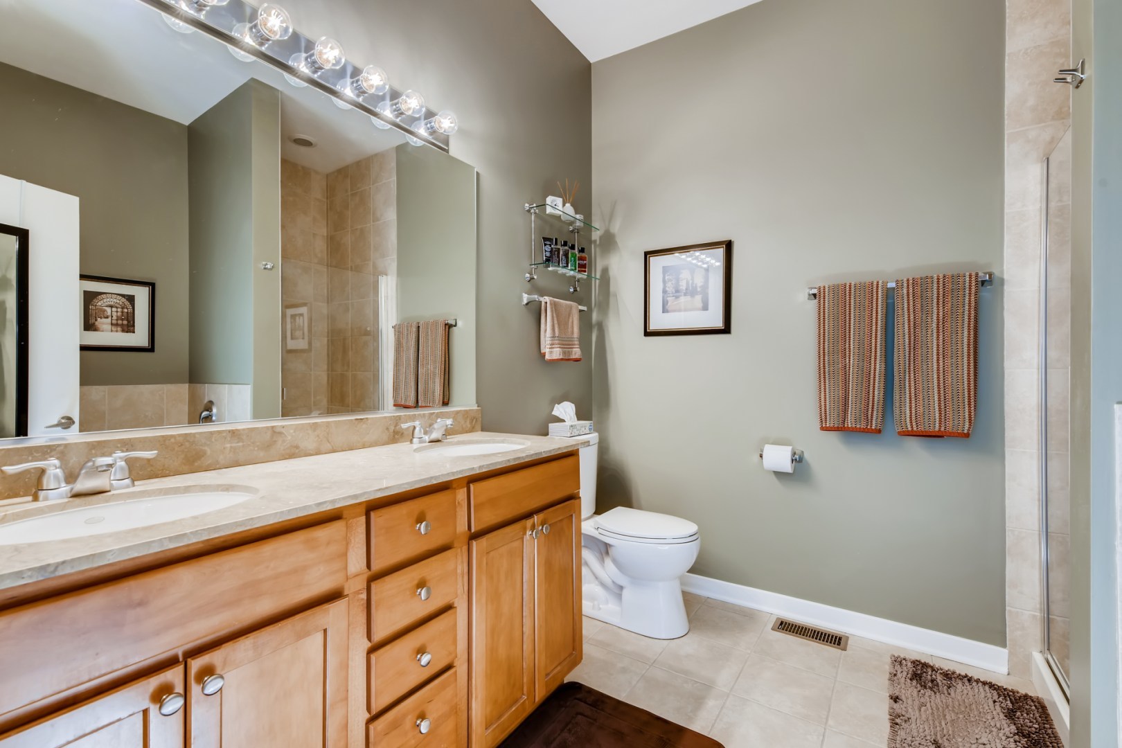 1244 West Monroe Street, Unit 5 Chicago, IL 60607 - Photo 15 of 21 a bathroom with a toilet sink and mirror