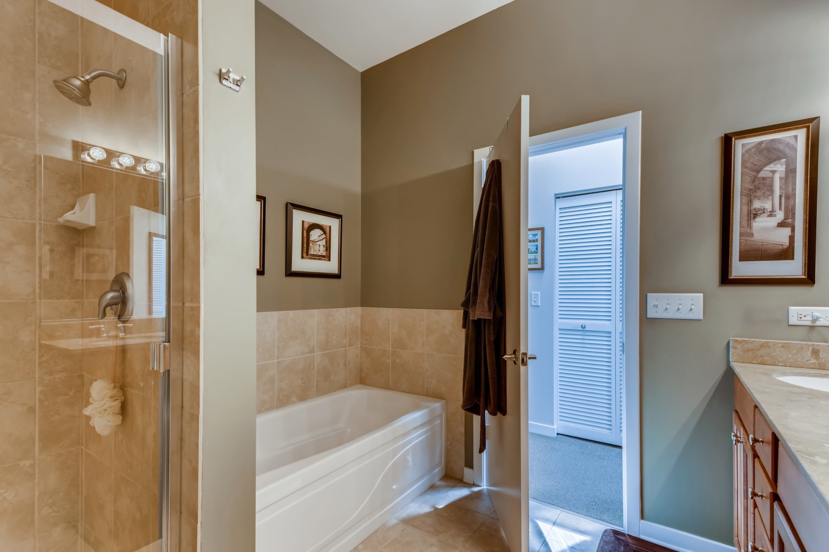 1244 West Monroe Street, Unit 5 Chicago, IL 60607 - Photo 16 of 21 a bathroom with a bathtub and a shower