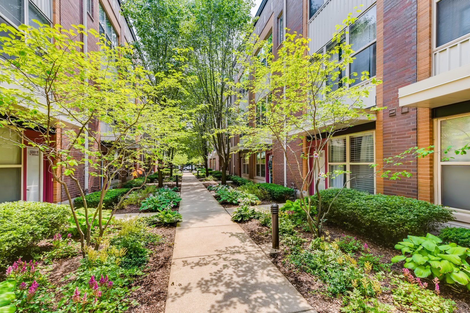 1244 West Monroe Street, Unit 5 Chicago, IL 60607 - Photo 20 of 21 a view of a pathway both side of house