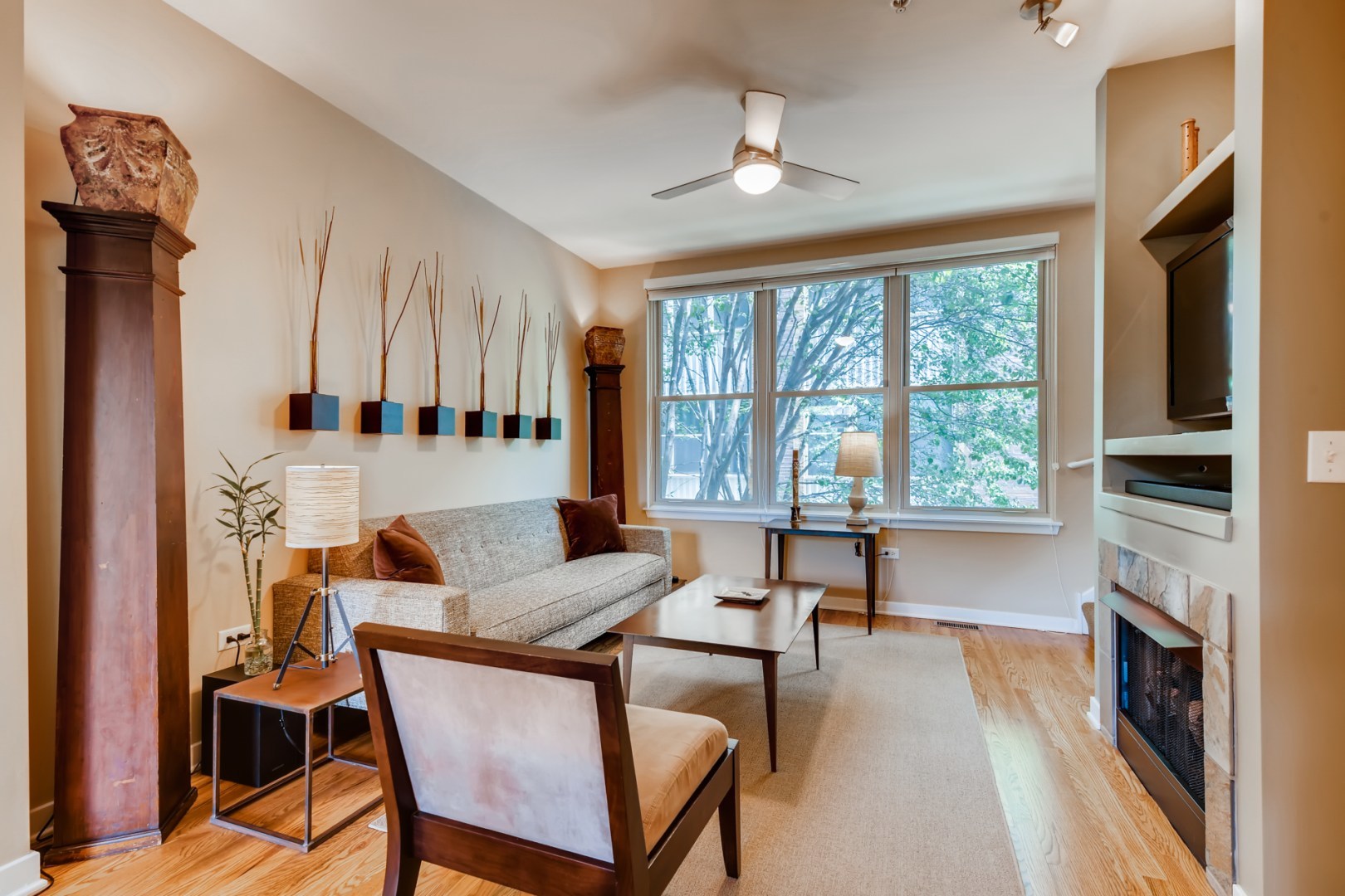 1244 West Monroe Street, Unit 5 Chicago, IL 60607 - Photo 3 of 21 a living room with furniture and a fireplace