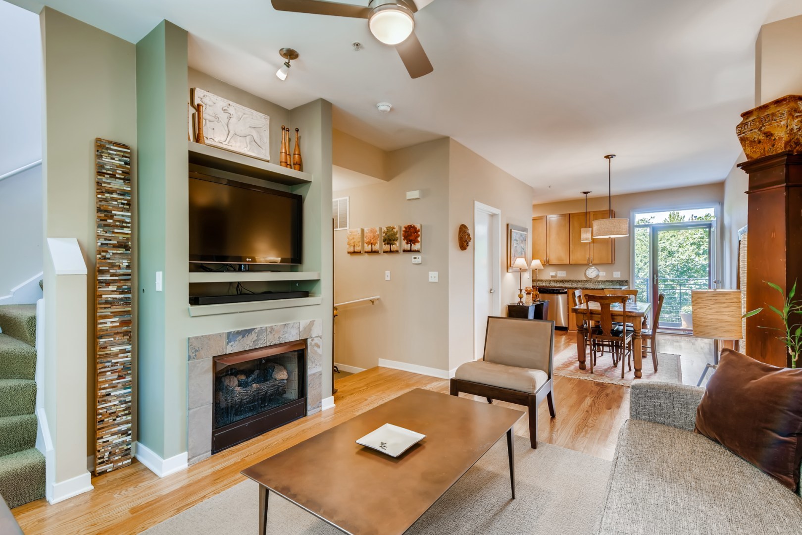 1244 West Monroe Street, Unit 5 Chicago, IL 60607 - Photo 4 of 21 a living room with furniture a flat screen tv and a fireplace