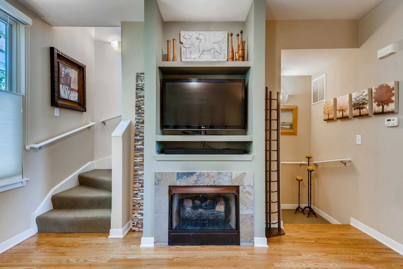 1244 West Monroe Street, Unit 5 Chicago, IL 60607 - Photo 5 of 21 a living room with a fireplace and a flat screen tv