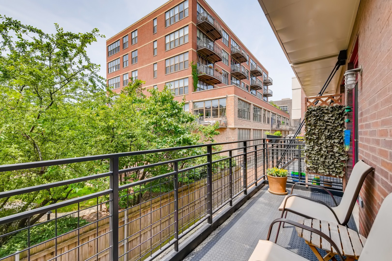 1244 West Monroe Street, Unit 5 Chicago, IL 60607 - Photo 10 of 21 a view of a balcony with chairs