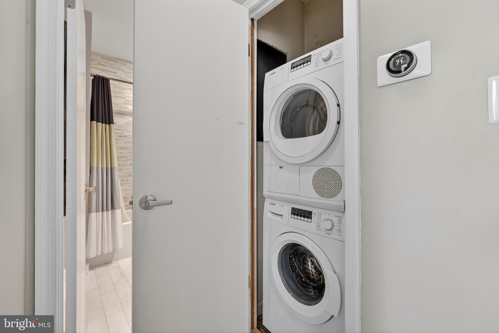 2001 16th Street Northwest, Unit 307 Washington, DC 20009 - Photo 12 of 27 a utility room with dryer and washer
