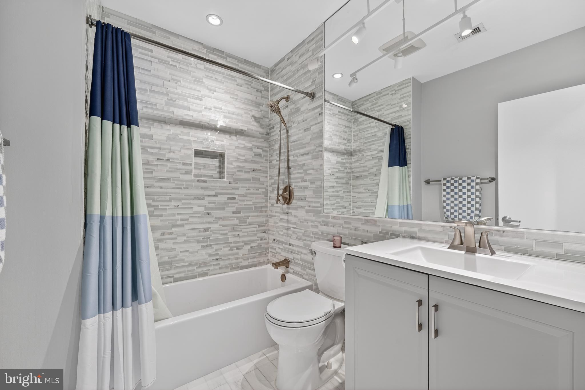 2001 16th Street Northwest, Unit 307 Washington, DC 20009 - Photo 13 of 27 a bathroom with a sink a toilet and shower