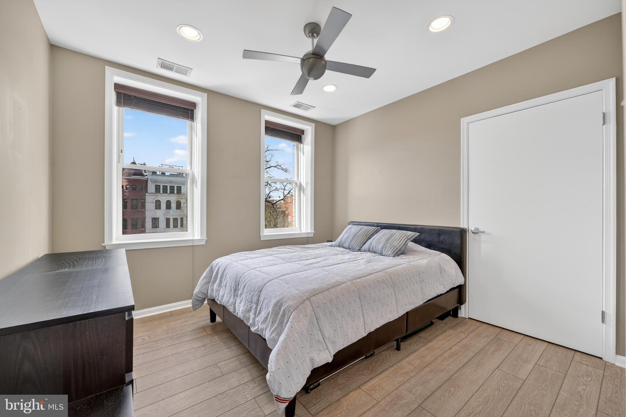 2001 16th Street Northwest, Unit 307 Washington, DC 20009 - Photo 14 of 27 a bedroom with a bed and a window