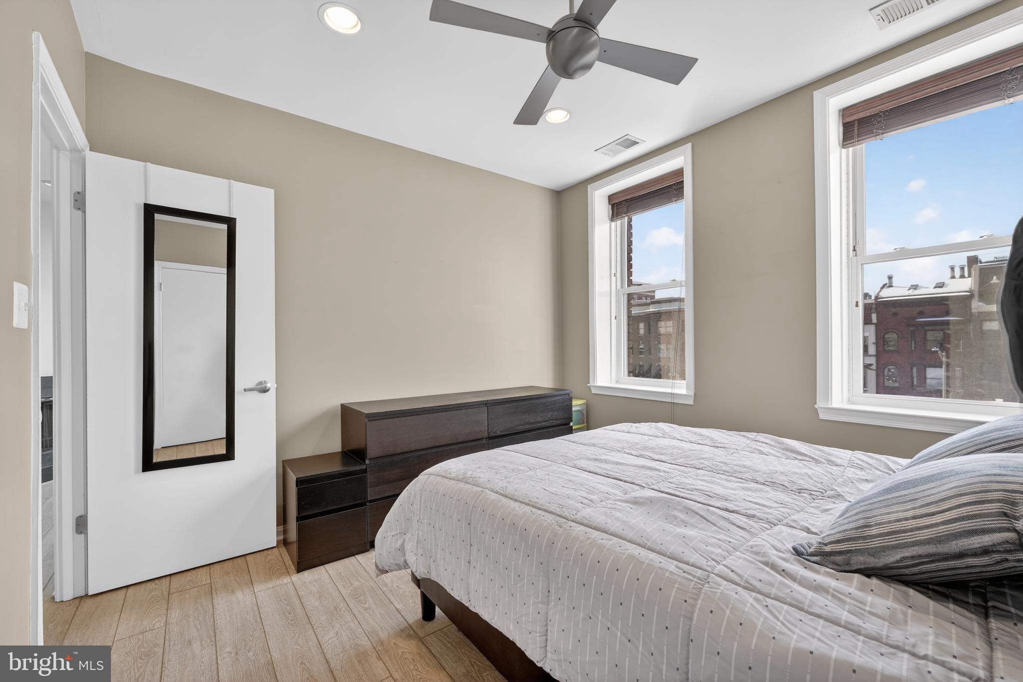 2001 16th Street Northwest, Unit 307 Washington, DC 20009 - Photo 15 of 27 a bedroom with a bed and a window