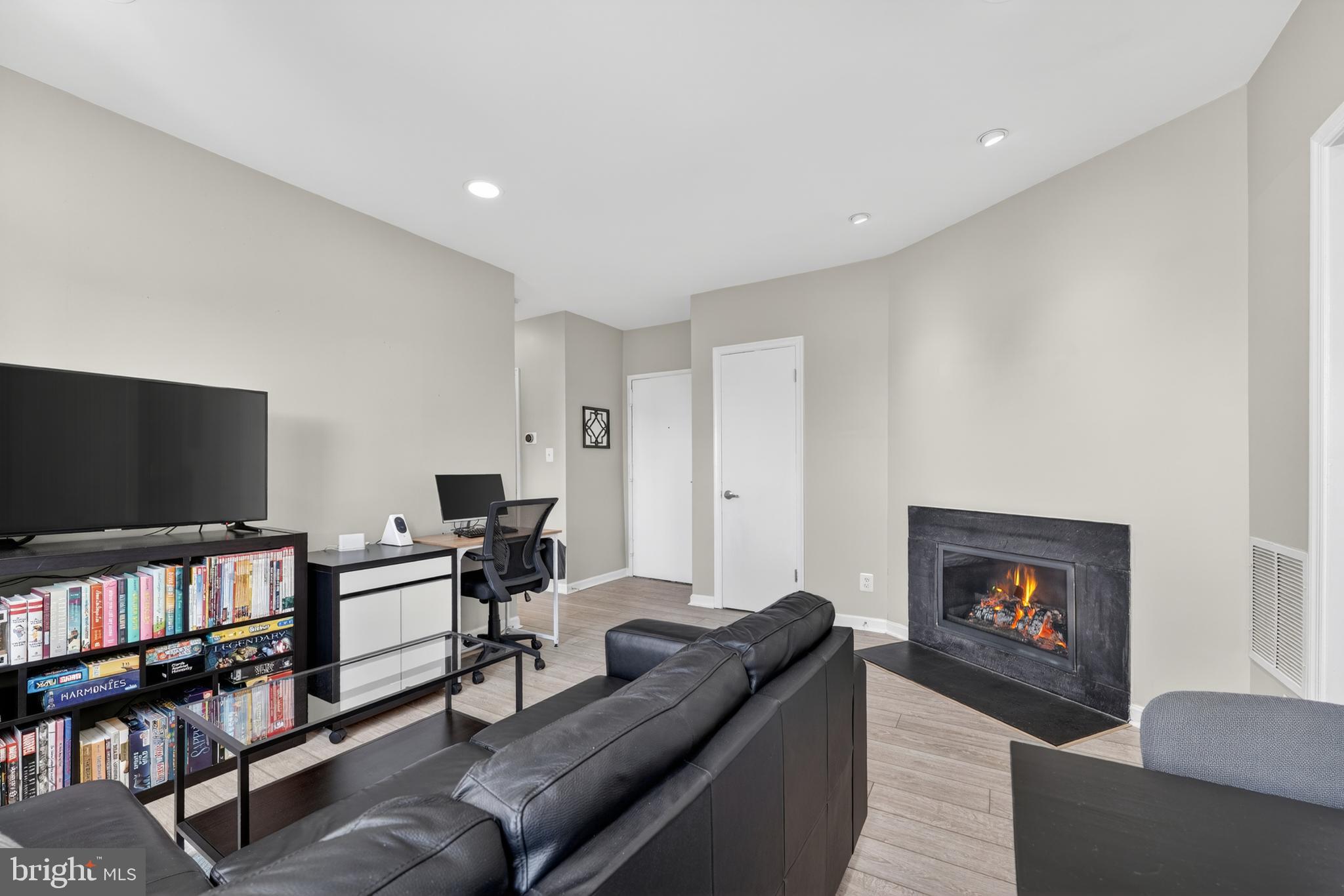2001 16th Street Northwest, Unit 307 Washington, DC 20009 - Photo 4 of 27 a living room with furniture and a flat screen tv