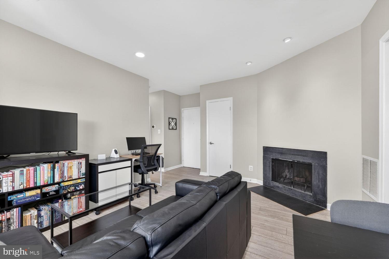 2001 16th Street Northwest, Unit 307 Washington, DC 20009 - Photo 4 of 29 a living room with furniture and a flat screen tv