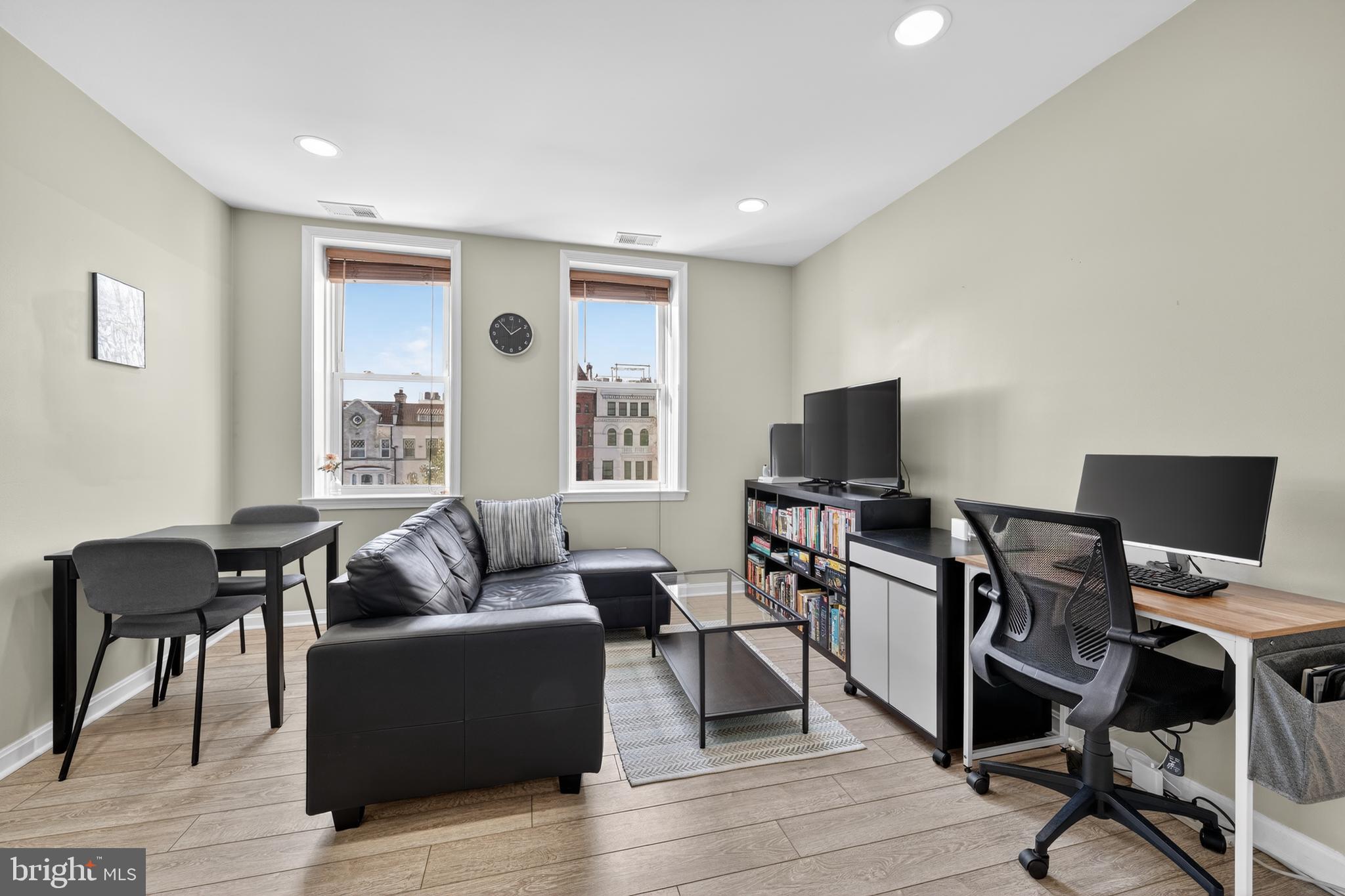 2001 16th Street Northwest, Unit 307 Washington, DC 20009 - Photo 5 of 27 a living room with furniture and a flat screen tv