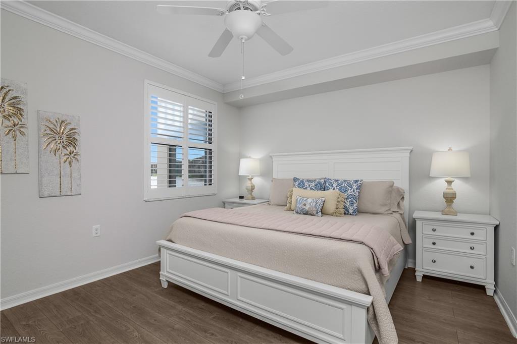 9560 Trevi Court, Unit 4811 Naples, FL 34113 - Photo 11 of 40 a bedroom with a bed and a window
