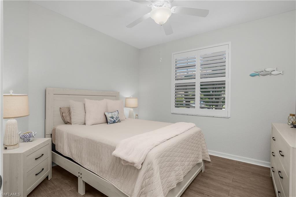 9560 Trevi Court, Unit 4811 Naples, FL 34113 - Photo 14 of 40 a bedroom with a bed and a window