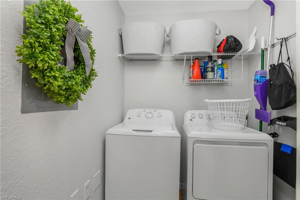 9560 Trevi Court, Unit 4811 Naples, FL 34113 - Photo 17 of 40 a utility room with dryer and washer