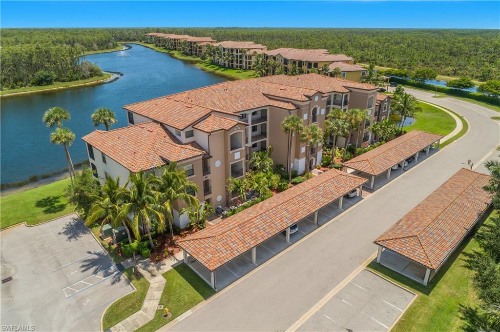 9560 Trevi Court, Unit 4811 Naples, FL 34113 - Photo 23 of 40 an aerial view of residential houses with outdoor space and river