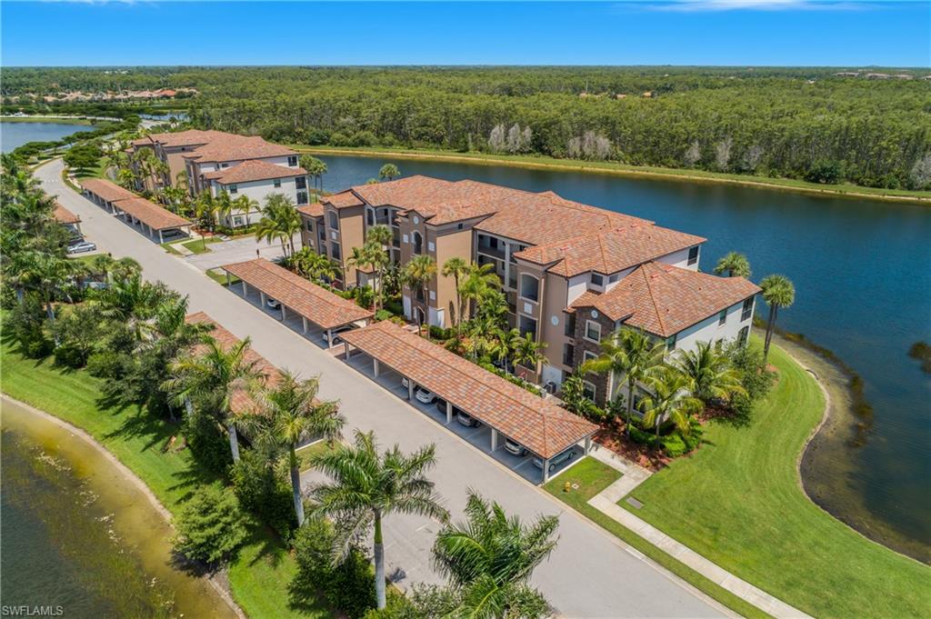 9560 Trevi Court, Unit 4811 Naples, FL 34113 - Photo 24 of 40 an aerial view of a house with a lake view