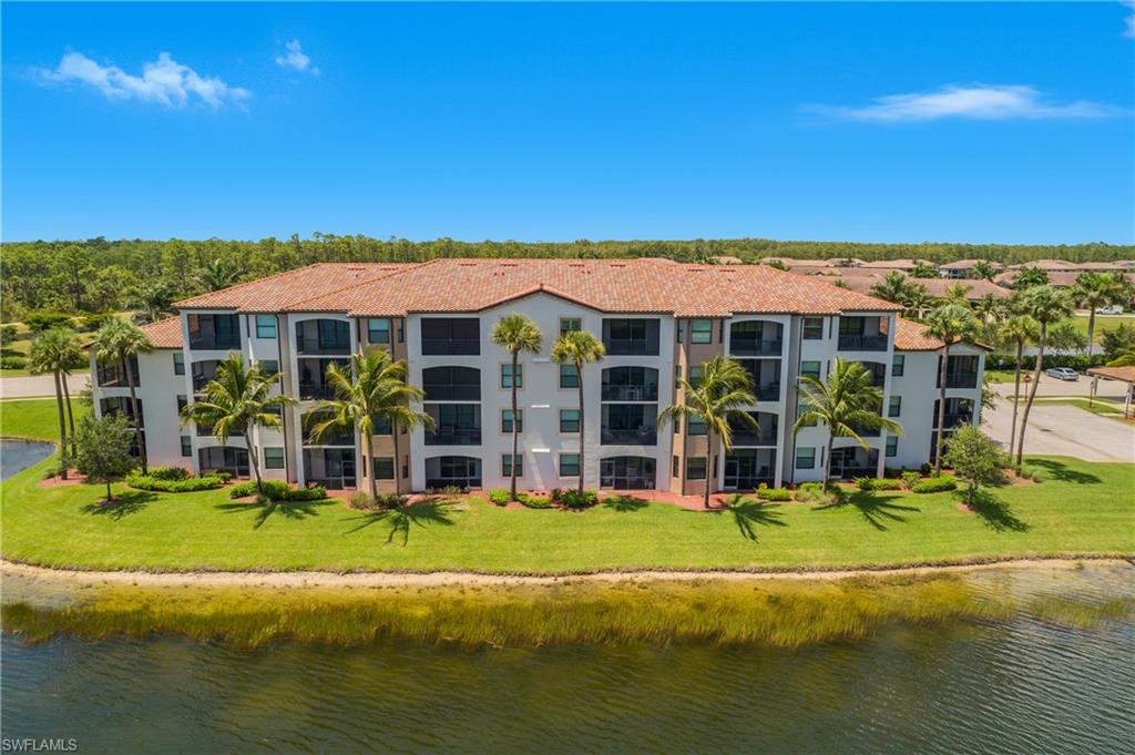 9560 Trevi Court, Unit 4811 Naples, FL 34113 - Photo 25 of 40 a view of a building with a swimming pool