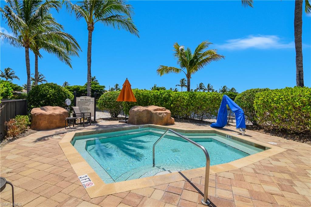 9560 Trevi Court, Unit 4811 Naples, FL 34113 - Photo 31 of 40 a view of a backyard with plants and swimming pool