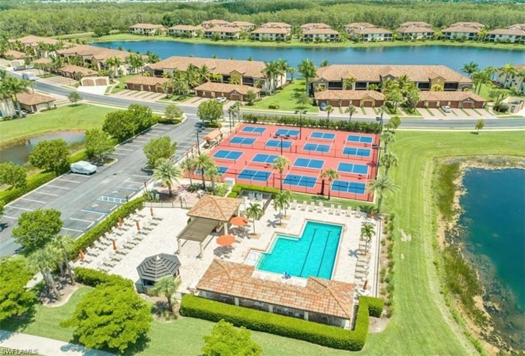 9560 Trevi Court, Unit 4811 Naples, FL 34113 - Photo 38 of 40 an aerial view of residential house with outdoor space and lake view