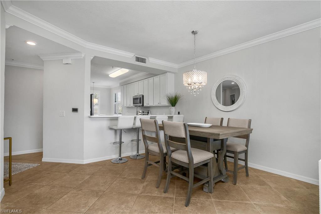 9560 Trevi Court, Unit 4811 Naples, FL 34113 - Photo 5 of 40 a view of a dining room and livingroom view