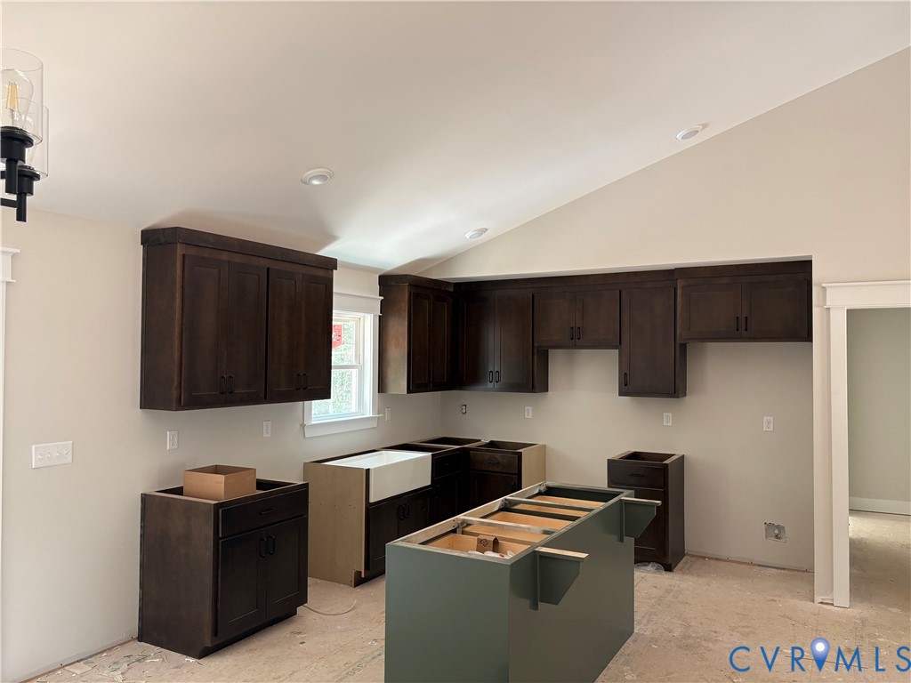 15135 Lebanon Road Spring Grove, VA 23881 - Photo 16 of 19 Kitchen featuring dark wood-finish cabinetry, a ce