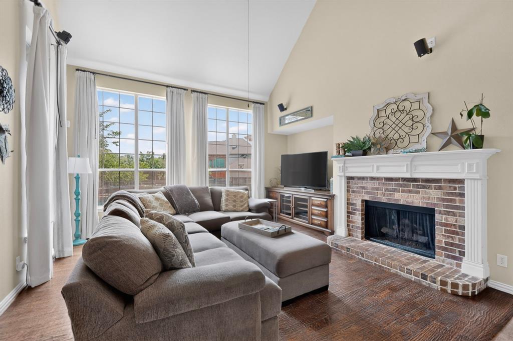 4004 White Porch Road Plano, TX 75024 - Photo 10 of 40 a living room with furniture window and a fireplace