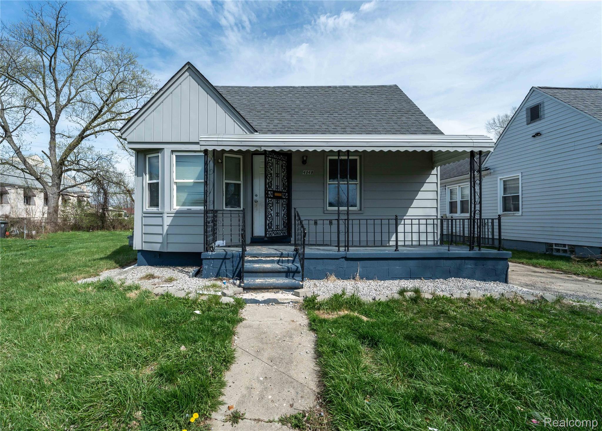 4049 Williams Street Inkster, MI 48141 - Photo 2 of 21 Bungalow-style house with a front lawn, roof with shingles, and a porch